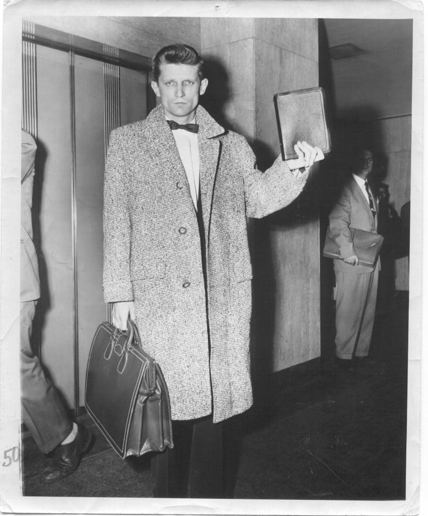 62 Years of Miracles at Adult & Teen Challenge 2 David Wilkerson with Bible outside courtroom scaled 1